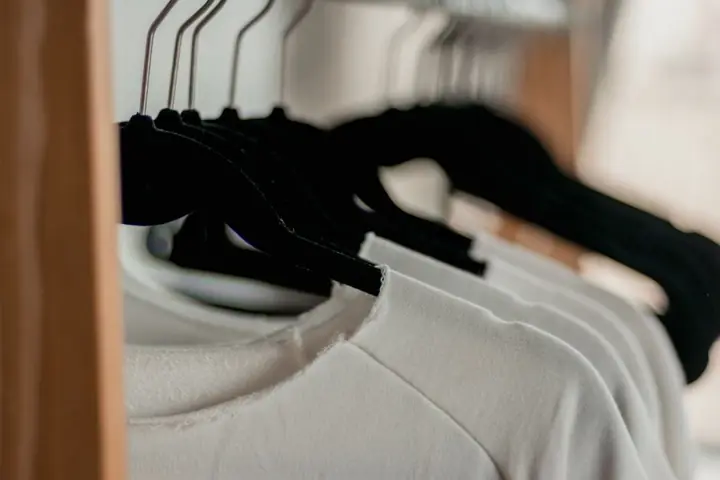 clothes on hangers dry cleaning store